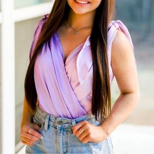 Lavender/Lilac bodysuit with tie on shoulders. 100% polyester